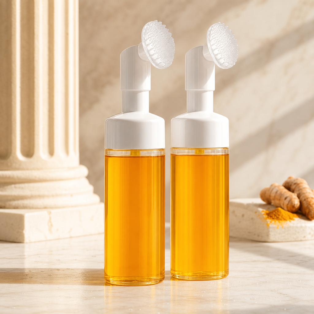 First Light golden turmeric cleansing foam duo on marble in dawn light